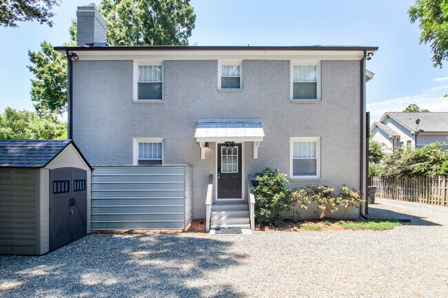 Rear of the building. Plenty of private parking. Outdoor shed has bicycles for your use. - 1111 Herrin Ave