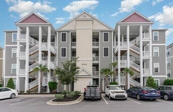 Building Photo - The Villages at Queens Harbour II