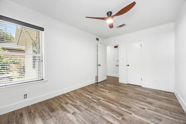 Building Photo - **$40K+ IN UPGRADES AND A FENCED BACKYARD WITH TWO STORAGE BUILDINGS**