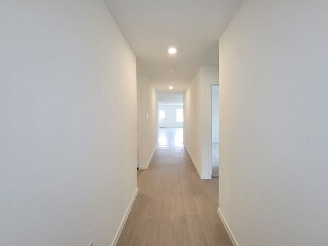 Building Photo - This great new single-story design makes smart use of the space available. At the front are all t...