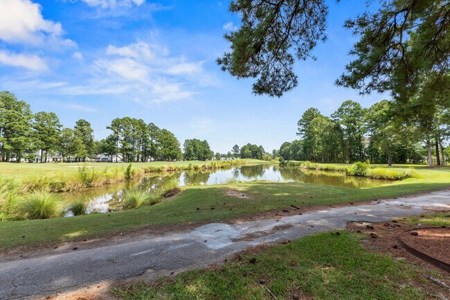 Building Photo - Modern 4BR Home with Screened Porch & Pond Views | Sun Colony, Longs SC