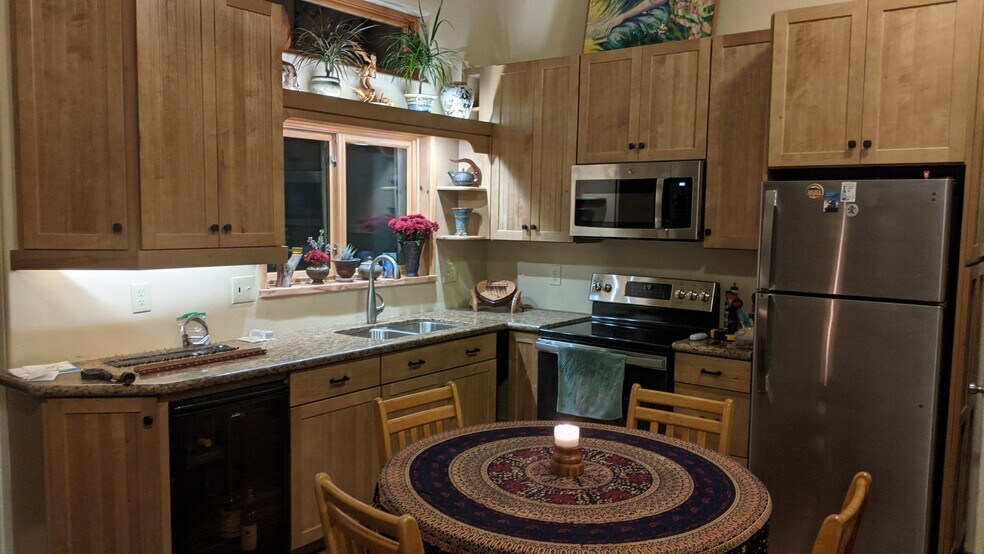 New custom kitchen with granite countertops and wine cooler - 13915 Mussey Grade Rd