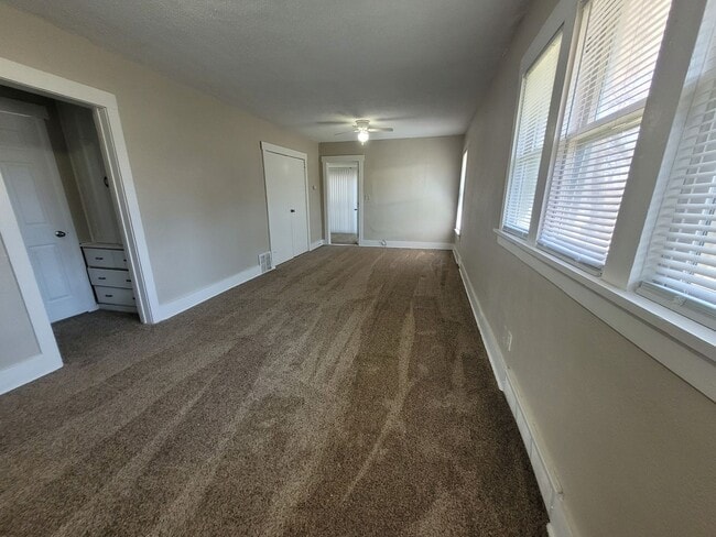 Building Photo - Four bedroom home on Indianola Ave with large yard and two decks!