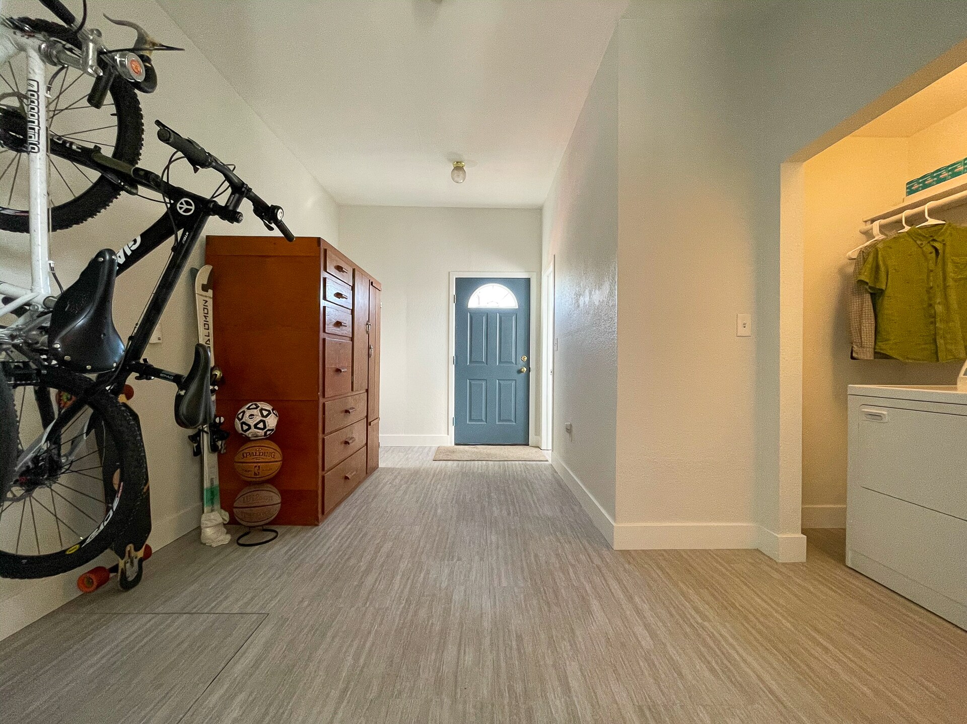Spacious mudroom with 2 wall mounted bike racks and storage cabinet included. - 4404 Sherman St