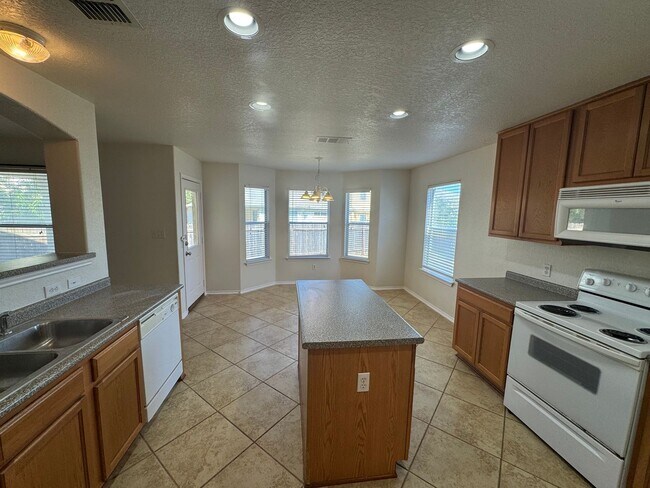 Building Photo - CUTE 2-STORY NESTLED ON A CUL-DE-SAC FEATURING AN ISLAND KITCHEN WITH STOVE/RANGE, DISHWASHER, MI...