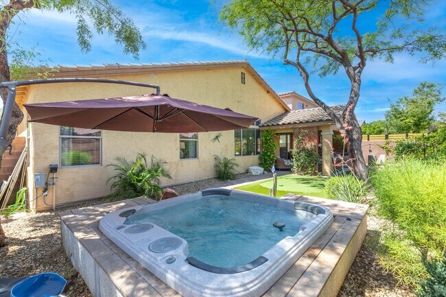Building Photo - Spacious Mountain’s Edge Home with Den, Sunroom, 3-Car Garage & Private Spa Retreat