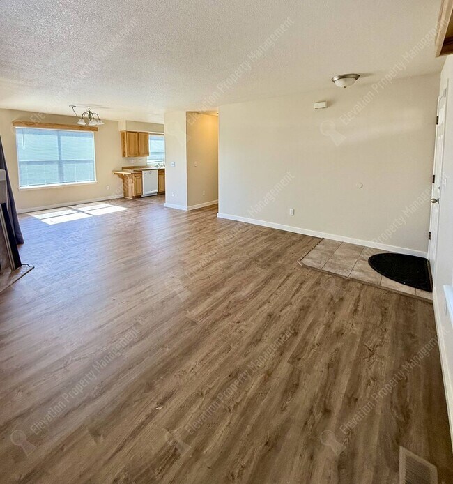 Building Photo - Updated 3 BR/2.5  BA with new flooring and paint!