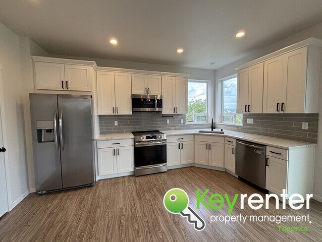 Building Photo - Stylish 4-Bedroom Home with Finished Basem...
