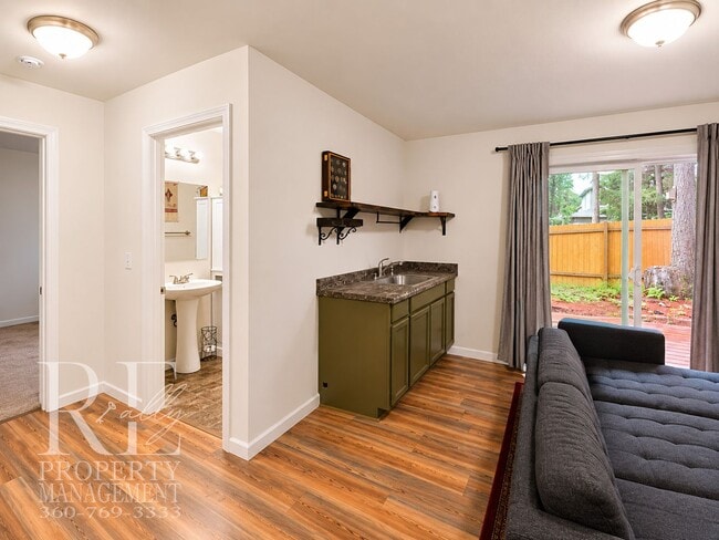 Building Photo - Spacious 3-Story Home with Flexible Living Space, Heat Pump & Private Deck Retreat