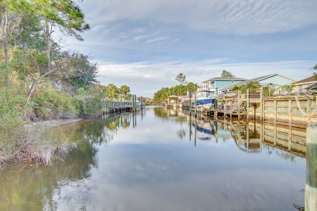 Building Photo - Live the Gulf Breeze Waterfront Life – Dock, Canal Access & Boat Lift!