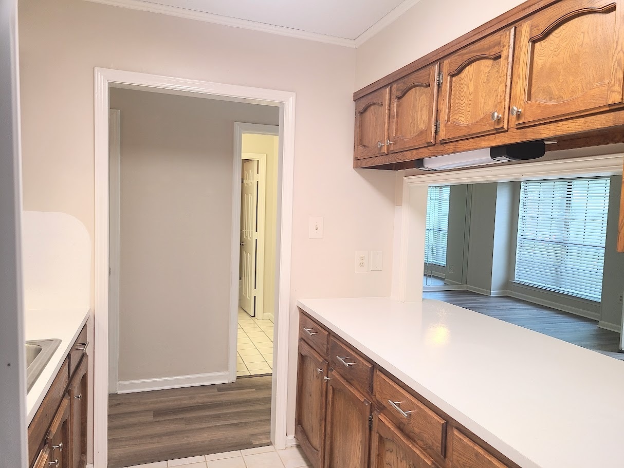 Kitchen positioned to stay in touch with family or friends in living room too - 12439 Coursey Blvd