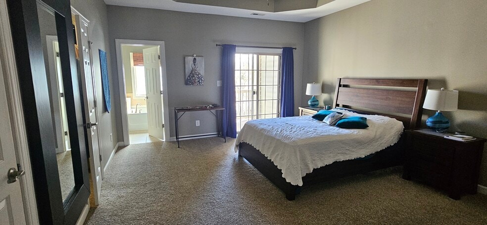 Primary bedroom with private balcony - 423 Panorama Park Pl