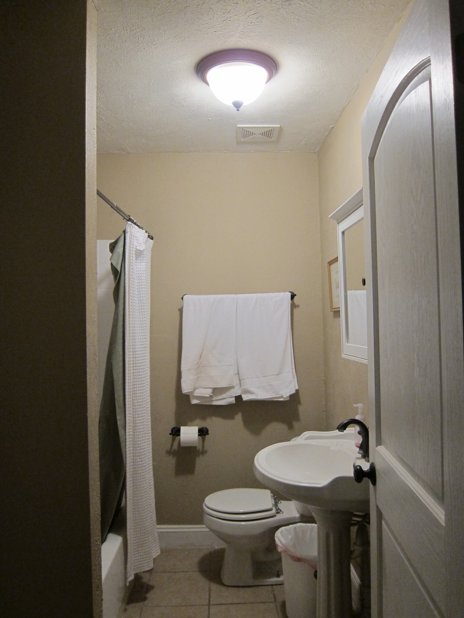 The shared full bathroom. - 1525 South 7th Street