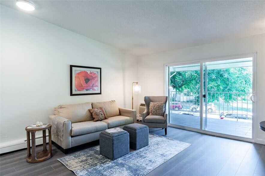 Living room with vaulted ceilings-no one is above you! Opens to patio. - 600 S Clinton St