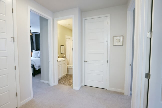 Master bedroom on the left, guest bath, and laundry closet. - 15637 E Broncos Pl