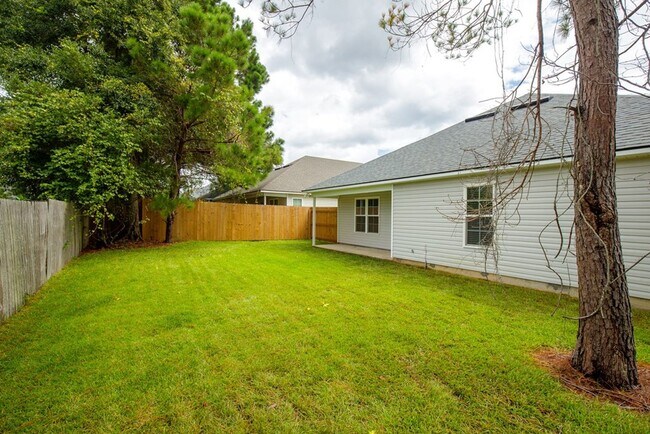 Building Photo - Contemporary 4BR/2BA Home with 2-Car Garage, Spacious Yard, and Close Proximity to Moody Air Forc...