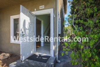 OUTSIDE DOOR AT BOTTOM OF STAIRS - 8408 Wiley Post Ave
