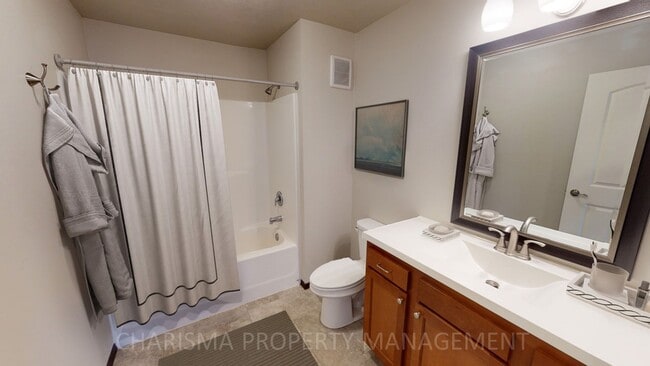 Building Photo - LOWER LEVEL 3 BEDROOM, 2 BATH TOWN HOME, INDIVIDUAL ENTRANCE, DOUBLE ATTACHED GARAGE, PET FRIENDLY