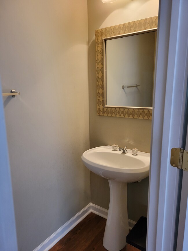 Half bath right off the living area - 205 Woodstone Dr