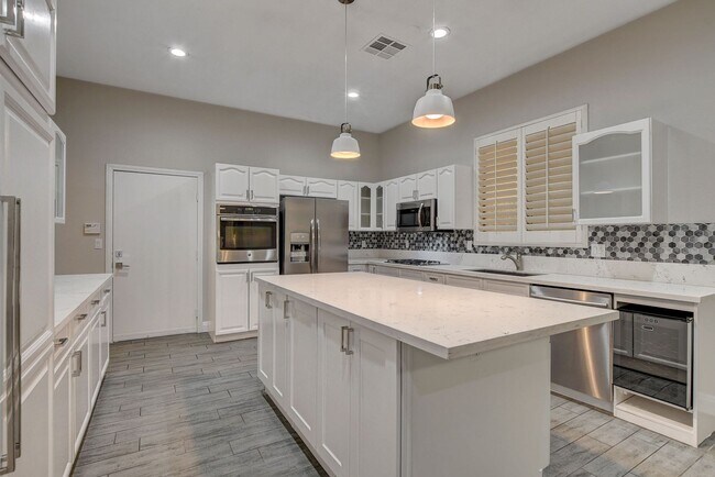 Building Photo - 4 bedroom, 3-bath home with a Pool!