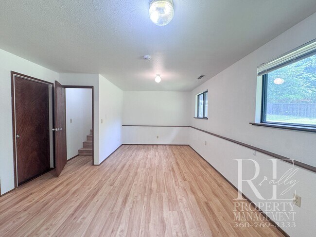 Building Photo - Spacious Poulsbo Home with Large Basement, Fenced Yard & Garden Space