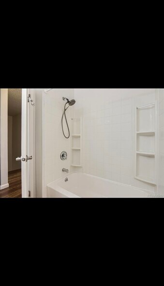 Secondary bathroom with shower and tub - 7137 S Webster St