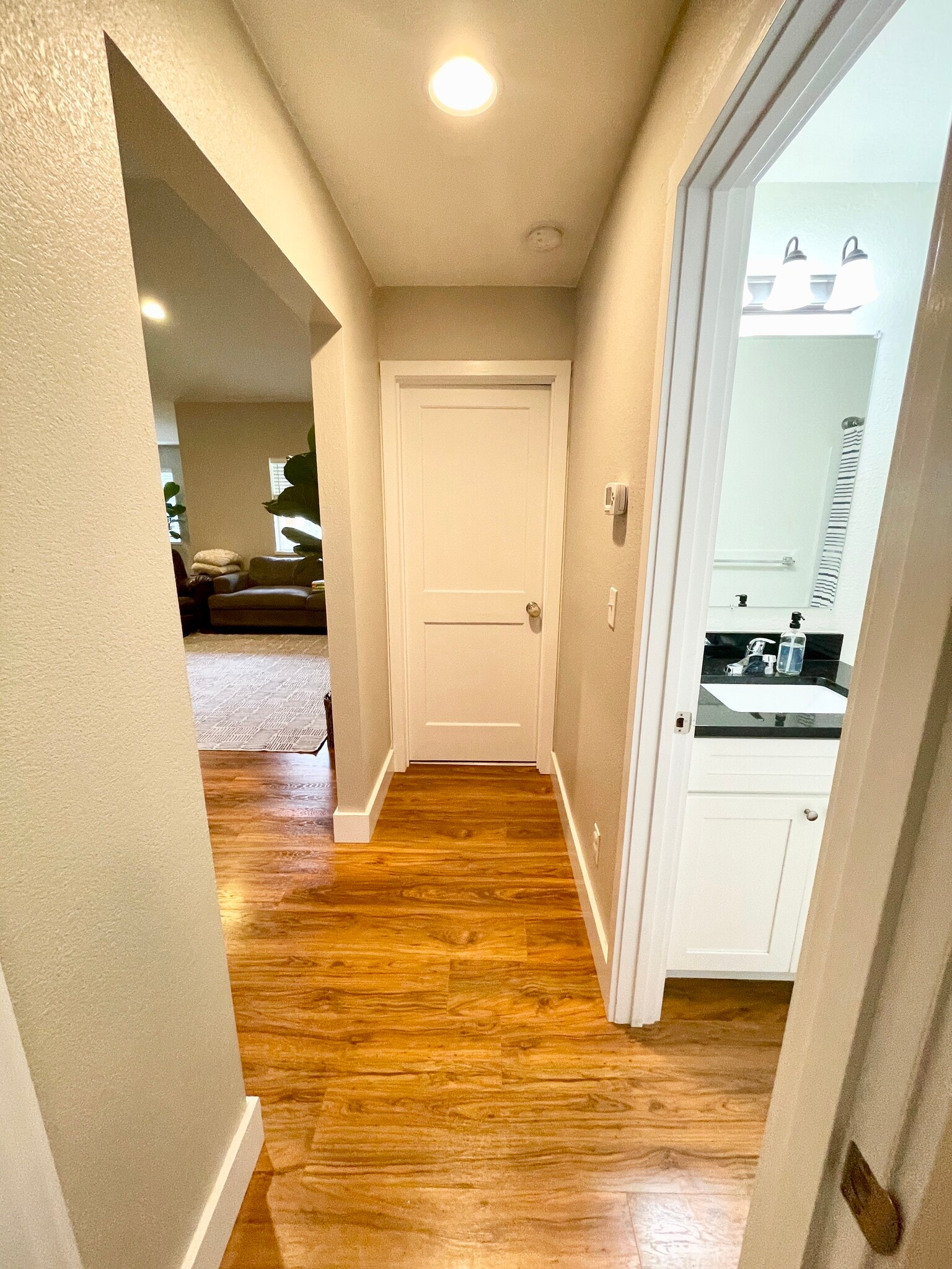 Hall between two bedrooms and guest bath. - 627 N 3rd St