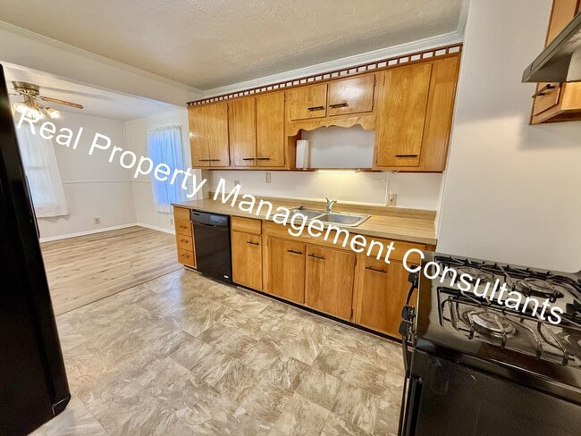 Building Photo - Charming 3-Bedroom Home with Covered Deck ...