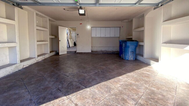 Building Photo - Great 3 bedroom and 1.5 bath townhouse with a small yard and 2 car garage.