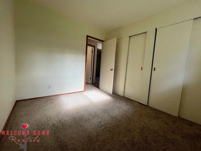 Building Photo - Beautiful Remodeled Rambler!!!  Come enjoy this HUGE backyard!!  NEW CARPET!!