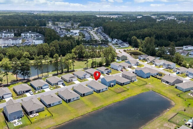 Building Photo - Modern 4BR Home with Screened Porch & Pond Views | Sun Colony, Longs SC