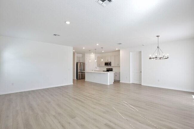 Building Photo - Stylish Sunbrooke Sanctuary! Modern 4/2 Home with High Ceilings, Designer Kitchen & Resort Amenities