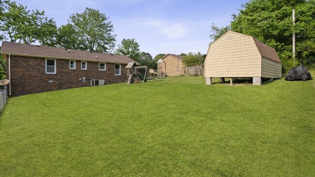 Building Photo - For Rent : 4BR, 1 1/2BA home with fenced in back yard and storage building.