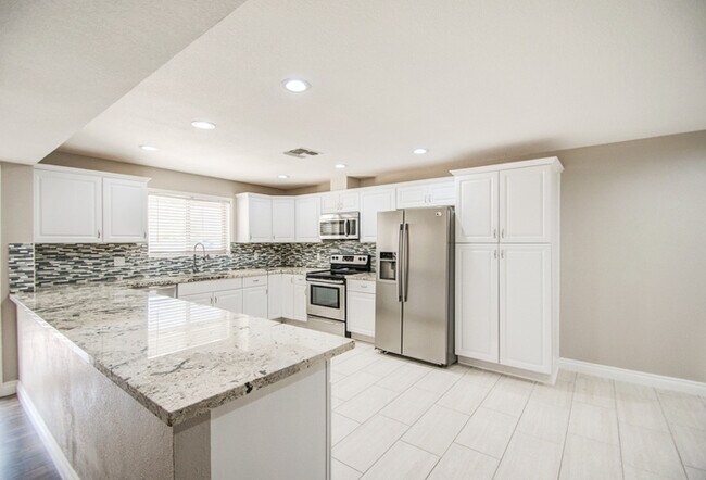 Building Photo - Beautifully remodeled corner 4/2 with pool...