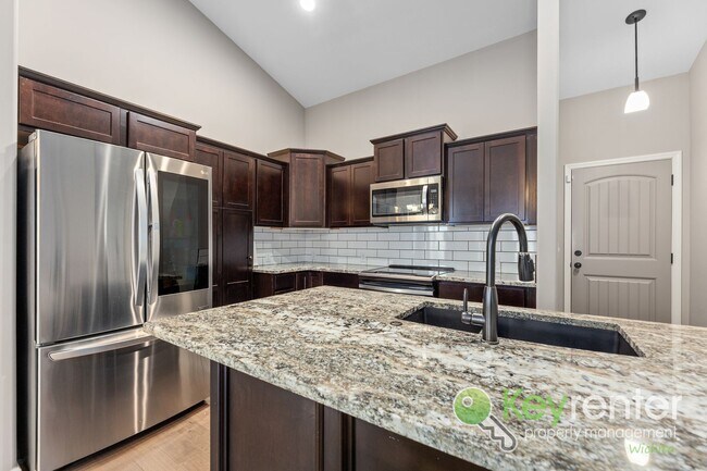 Building Photo - Spacious 4-Bedroom Home with Finished Basement & 3-Car Garage – Derby, KS