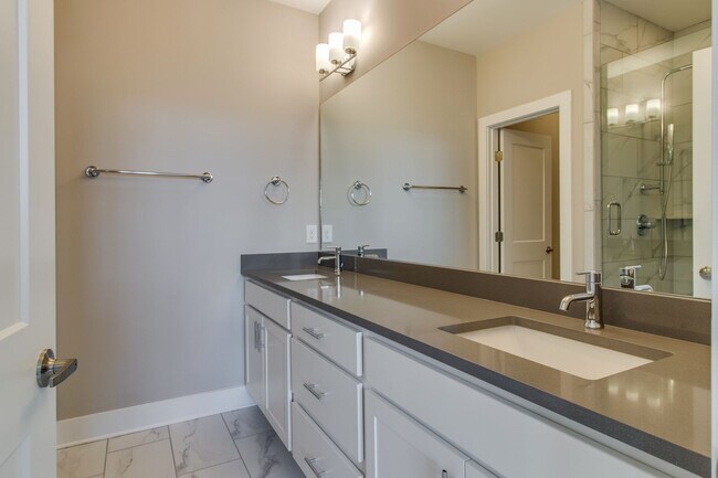 Double sink vanity with lots of counter space in on suite master bath - 707 Vernon Ave