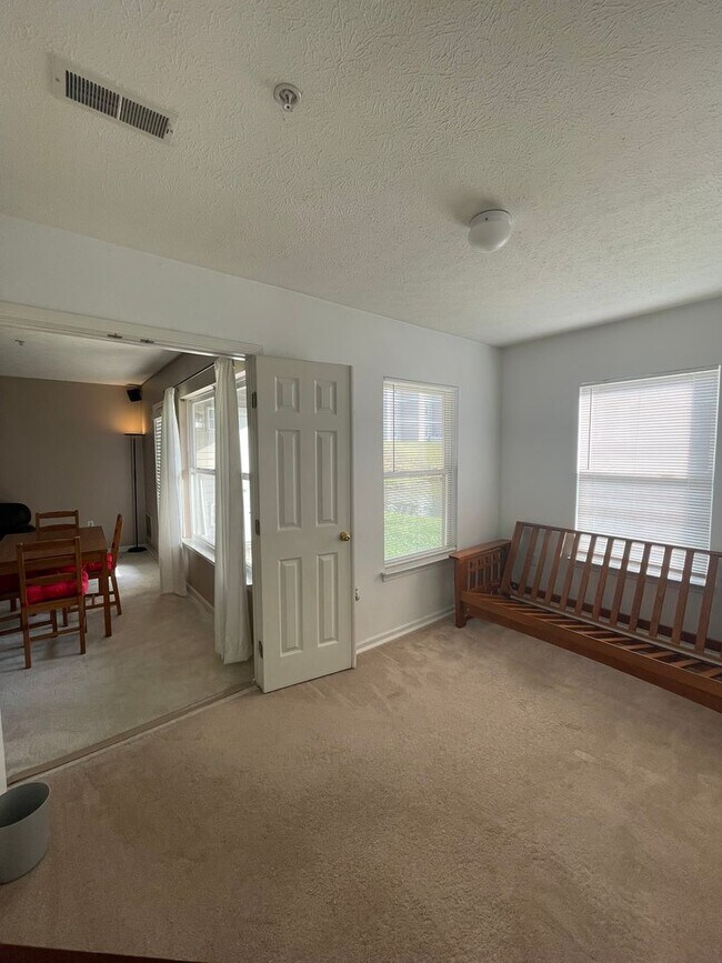 Building Photo - 2 Bed + Office Condo | Pool, Garage & Flexible Move-In