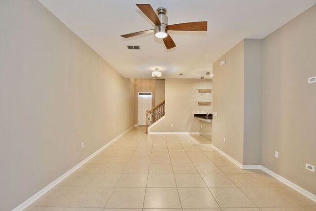 Building Photo - Gorgeous 4/2.5 Spacious Townhome with a Loft Area and a 2 Car Garage in the Desirable Gated Commu...