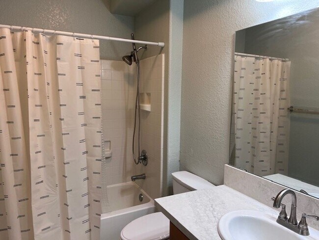 Building Photo - Beautifully updated condo in gated community. Sparkling pool. Stainless steel appliances and lami...