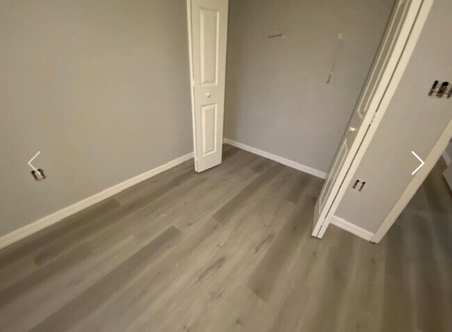 Building Photo - Available NOW! NEW FLOORS AND PAINT! Lovely 3/2 in Poinciana! HUGE fenced yard and NO CARPET!