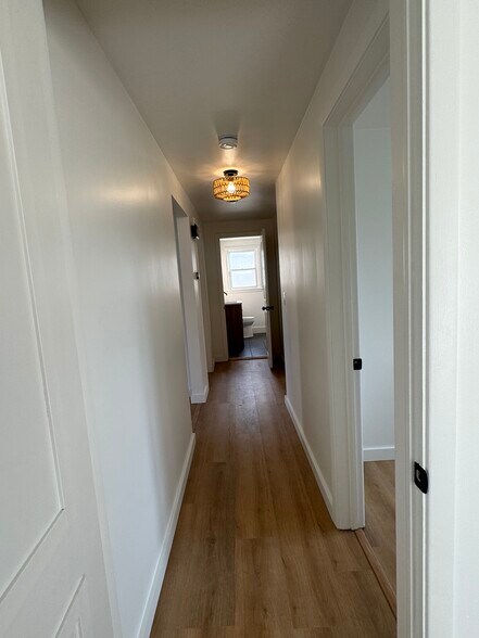 Hallway looking into bathroom and bedroom 1 - 249 Dunlop Ave