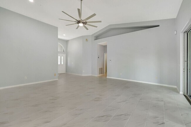 Building Photo - A BOATER'S PARADISE WITH THIS STUNNING 3 BEDROOM, 2 BATH WATERFRONT POOL HOME W/DOCK & BOAT LIFT ...