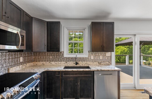 Building Photo - Beautifully Updated Three-Bedroom with Koi...