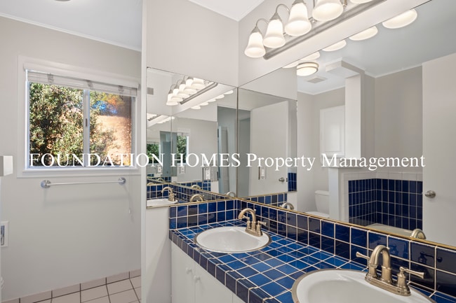 Building Photo - Bright & Tranquil End Unit!  A/C! Parking! Community Pool! FOUNDATION