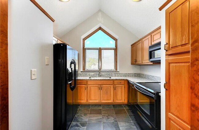 Building Photo - COMING SOON: Charming 2-Bedroom Condo in a...
