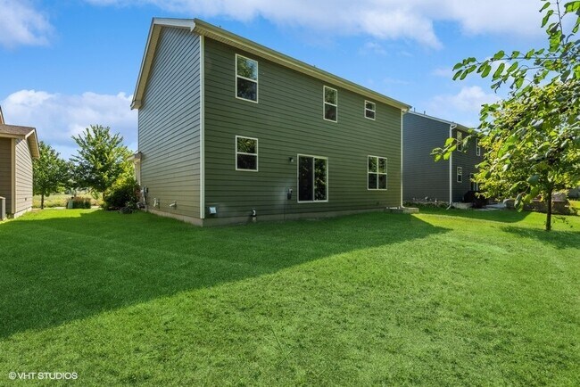 Grass and trees in backyard - 4505 Yellowstone Ln N