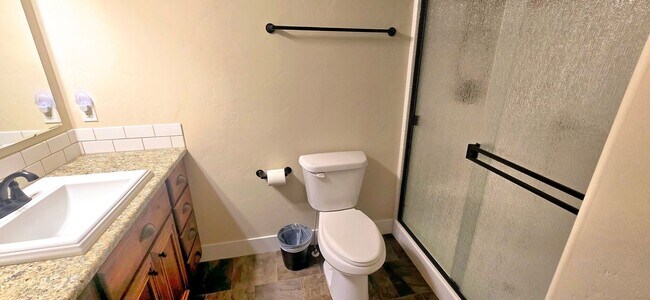 Building Photo - THREE-CAR GARAGE! This charming home offers 3 bedrooms, plus an office/rec room, and 2 bathrooms.