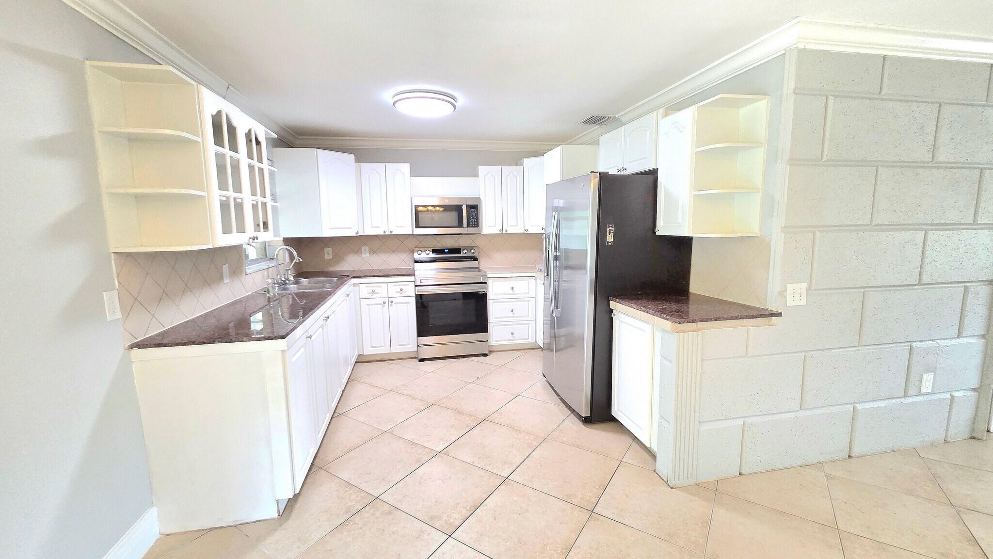 Kitchen with Stainless Steel Appliances - 5529 Hardee St