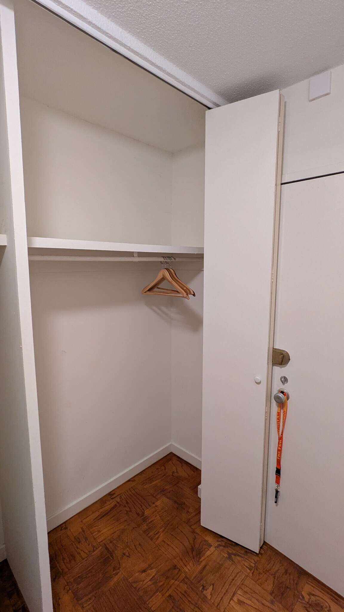 Hallway closet is tall with high overhead clearance for storage. - 490 M St SW