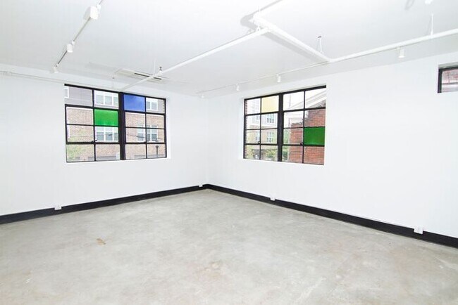 Building Photo - Check out this studio ! We want you to cal...